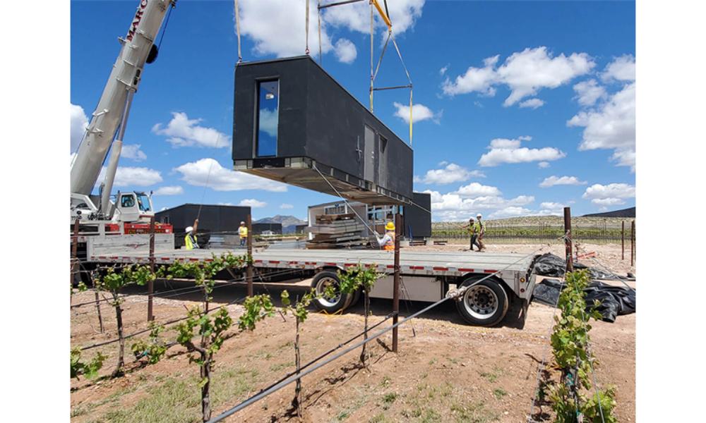 Project case image for the ZenniHome construction project in the United States. The image shows a cabinet unloading scene, with workers carefully handling and transporting modern cabinetry. The setting highlights the logistics process, showcasing attention to detail, organization, and the preparation phase for installing high-quality cabinets in the project.