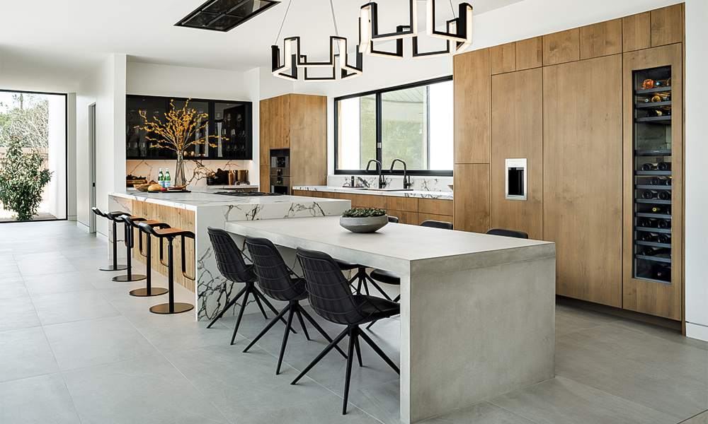 A modern L-shaped kitchen featuring wood veneer cabinets and a central countertop island. The warm wood tones bring a natural and inviting feel to the space, while the L-shaped layout offers excellent functionality and flow. The central island provides additional workspace and serves as a stylish focal point in this contemporary kitchen design.