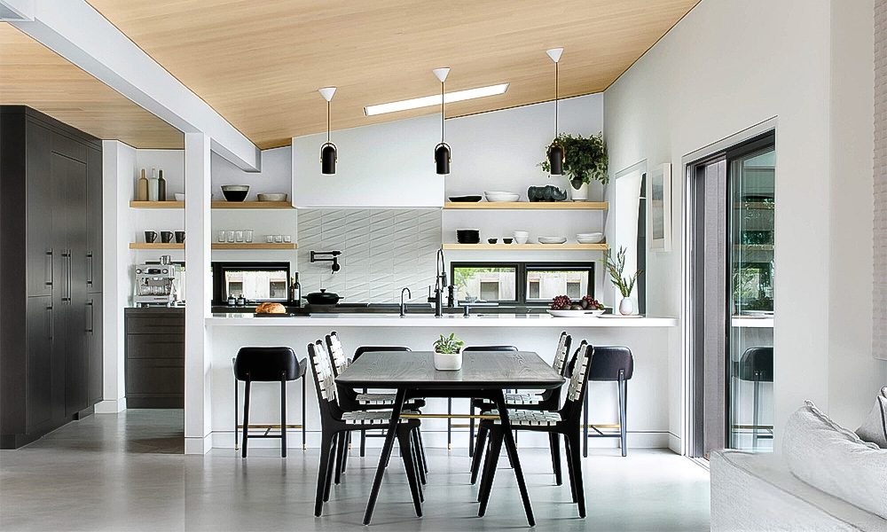 A sleek one-wall kitchen with white cabinets and a central countertop island. The minimalist white cabinetry creates a clean and open atmosphere, while the linear layout offers an efficient workflow. The central island provides additional workspace and a stylish gathering point, enhancing the modern design. ChatGPT 说： A modern L-shaped kitchen with white cabinets and a central countertop island. The crisp white cabinetry enhances the bright and airy feel of the space, while the L-shaped layout maximizes functionality. The central island adds extra workspace and serves as an elegant focal point, completing the clean and contemporary design.