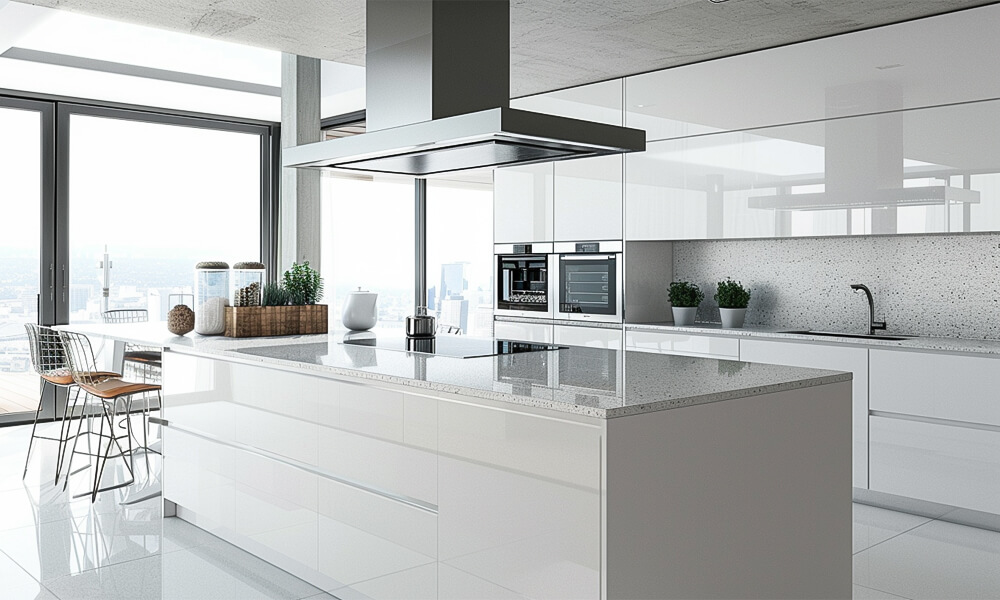 A modern kitchen with glossy white cabinets in a sleek, one-wall (I-shaped) layout. The high-gloss finish enhances the sense of brightness and space, reflecting light beautifully across the room. A central island with a smooth countertop adds both functionality and style, providing extra workspace and a gathering spot for dining or entertaining. Clean lines and minimalist details emphasize the contemporary aesthetic, creating an elegant and inviting kitchen atmosphere.
