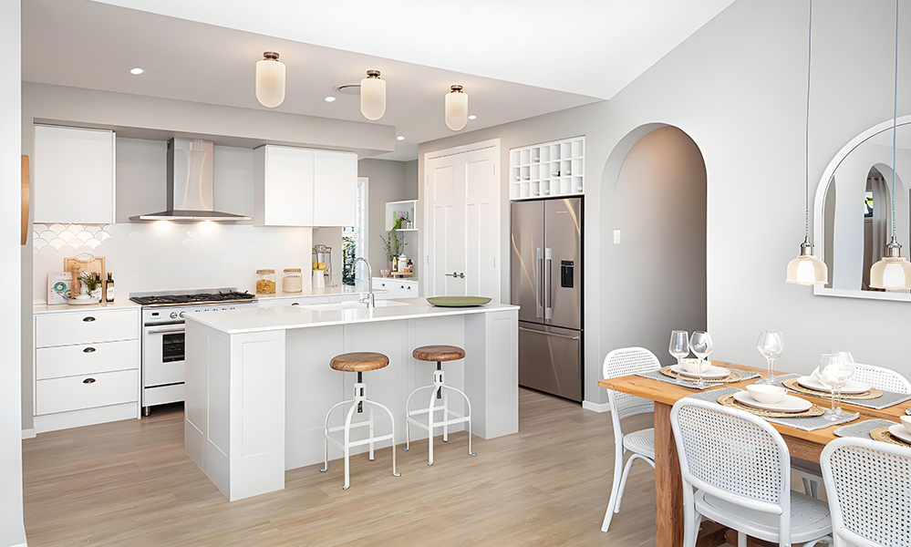 A one-wall kitchen with white lacquered cabinetry and a central island. The glossy white finish enhances the clean, modern aesthetic, while the island adds both practicality and a stylish focal point to the open, minimalist design.