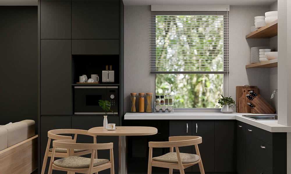 A sleek one-wall kitchen featuring black cabinetry, creating a bold and modern aesthetic. The deep black tones add a touch of sophistication and elegance, while the minimalist design ensures a functional and stylish layout.