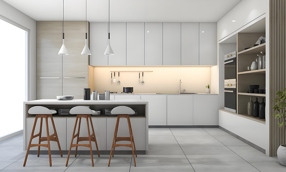 A modern kitchen with light gray cabinetry and a central island. The soft gray tones of the cabinets create a calm, sophisticated atmosphere, while the island adds both practicality and a stylish focal point to the space.