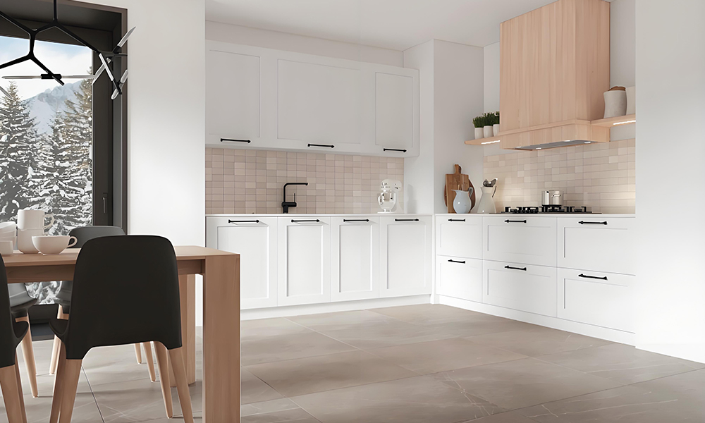 A close-up view of an L-shaped kitchen featuring glossy white lacquered cabinetry. The sleek, reflective surface of the cabinets enhances the modern, clean aesthetic of the space, with the minimalist design emphasizing the bright, airy atmosphere.