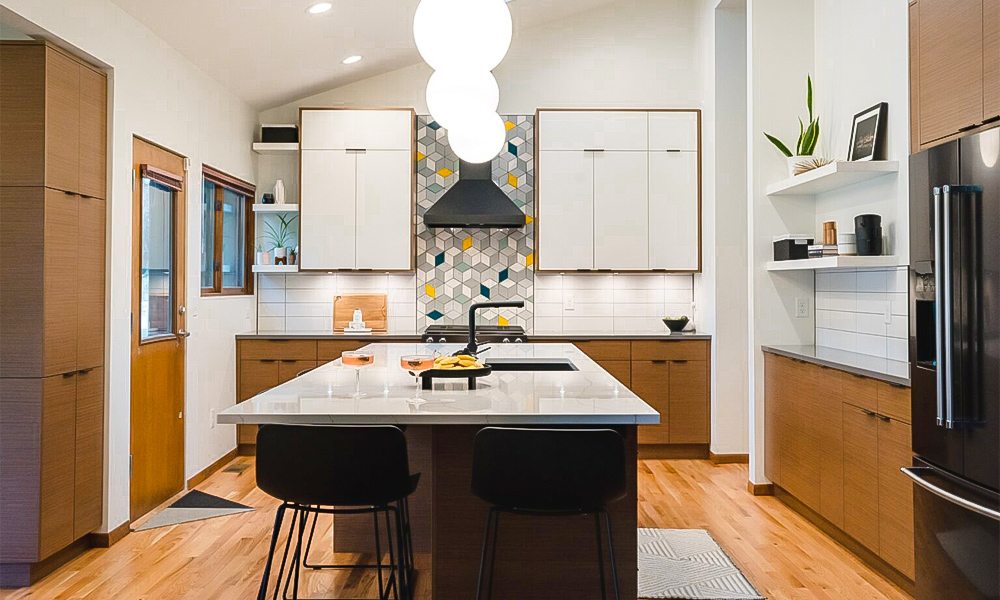 A modern U-shaped kitchen featuring wood veneer cabinetry, white countertops, and a central island. The warm wood tones add a natural and inviting atmosphere, while the white countertops provide a sleek, clean contrast. The central island offers additional workspace and serves as an elegant focal point in this contemporary kitchen design.
