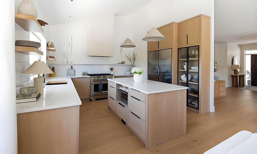 A modern U-shaped kitchen with light wood veneer cabinetry and a matching wood central island. The light wood tones bring a sense of warmth, brightness, and natural elegance to the space, while the U-shaped layout maximizes storage and efficiency. The central island serves as a functional and stylish centerpiece, ideal for meal prep, casual dining, or entertaining. The overall design showcases a harmonious blend of contemporary aesthetics and organic textures.