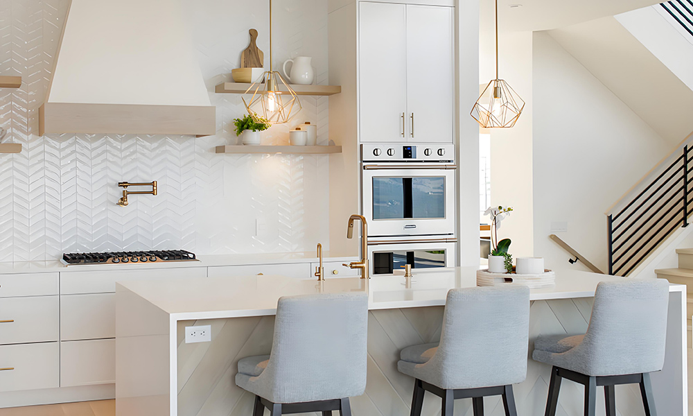 A modern one-wall kitchen featuring all-white cabinetry and a matching central island. The sleek white cabinets create a bright, clean, and spacious atmosphere, while the minimalist design emphasizes simplicity and elegance. The central island provides additional workspace and serves as a stylish focal point, perfect for food preparation and casual gatherings. This layout maximizes efficiency and storage, making it an ideal choice for contemporary living.