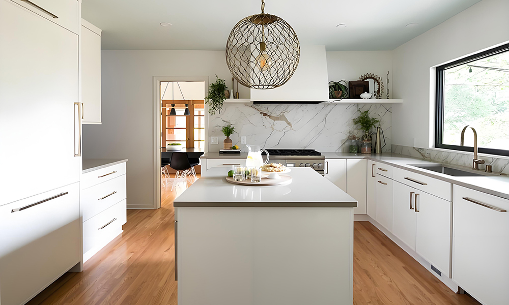 A modern U-shaped kitchen featuring white lacquered cabinets with a high-gloss finish, creating a clean and contemporary look. The design is complemented by a stunning marble central island, adding an elegant and luxurious touch to the space. The combination of sleek white cabinetry and the natural texture of marble offers a harmonious balance of style and functionality, with ample counter space for cooking and socializing. The overall design exudes modern sophistication and timeless appeal.