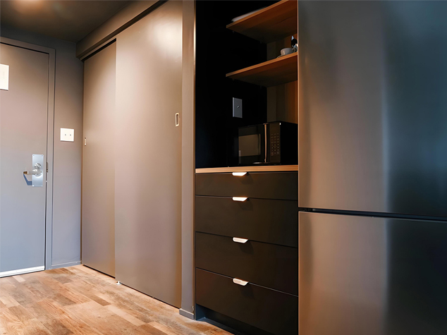 Project case image for an apartment project located at 275 Research Parkway in Meriden, USA. The close-up scene highlights the cabinetry details, showcasing sleek finishes, modern hardware, and high-quality materials. The design emphasizes clean lines, functionality, and contemporary style, enhancing the overall aesthetic of the space.