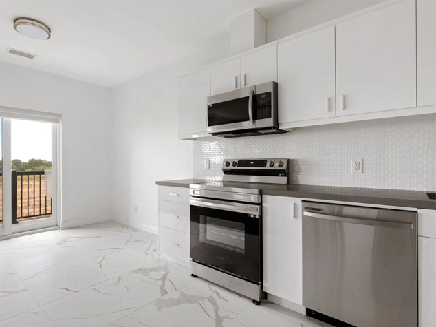 Project case image for the LaSalle Situats apartment project in Canada. The image features a modern kitchen with sleek cabinetry, highlighting clean lines and high-quality finishes. The design is both functional and stylish, offering ample storage space and a contemporary aesthetic that enhances the overall appeal of the apartment's interior.