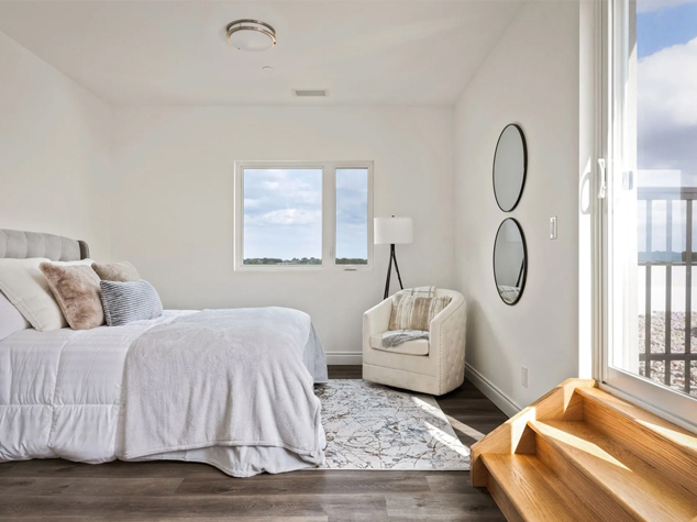 Project case image for the LaSalle Situats apartment project in Canada. The image showcases a cozy and modern bedroom with sleek furniture, soft lighting, and a calming color palette. The design emphasizes comfort and functionality, creating a serene space perfect for relaxation and restful sleep.