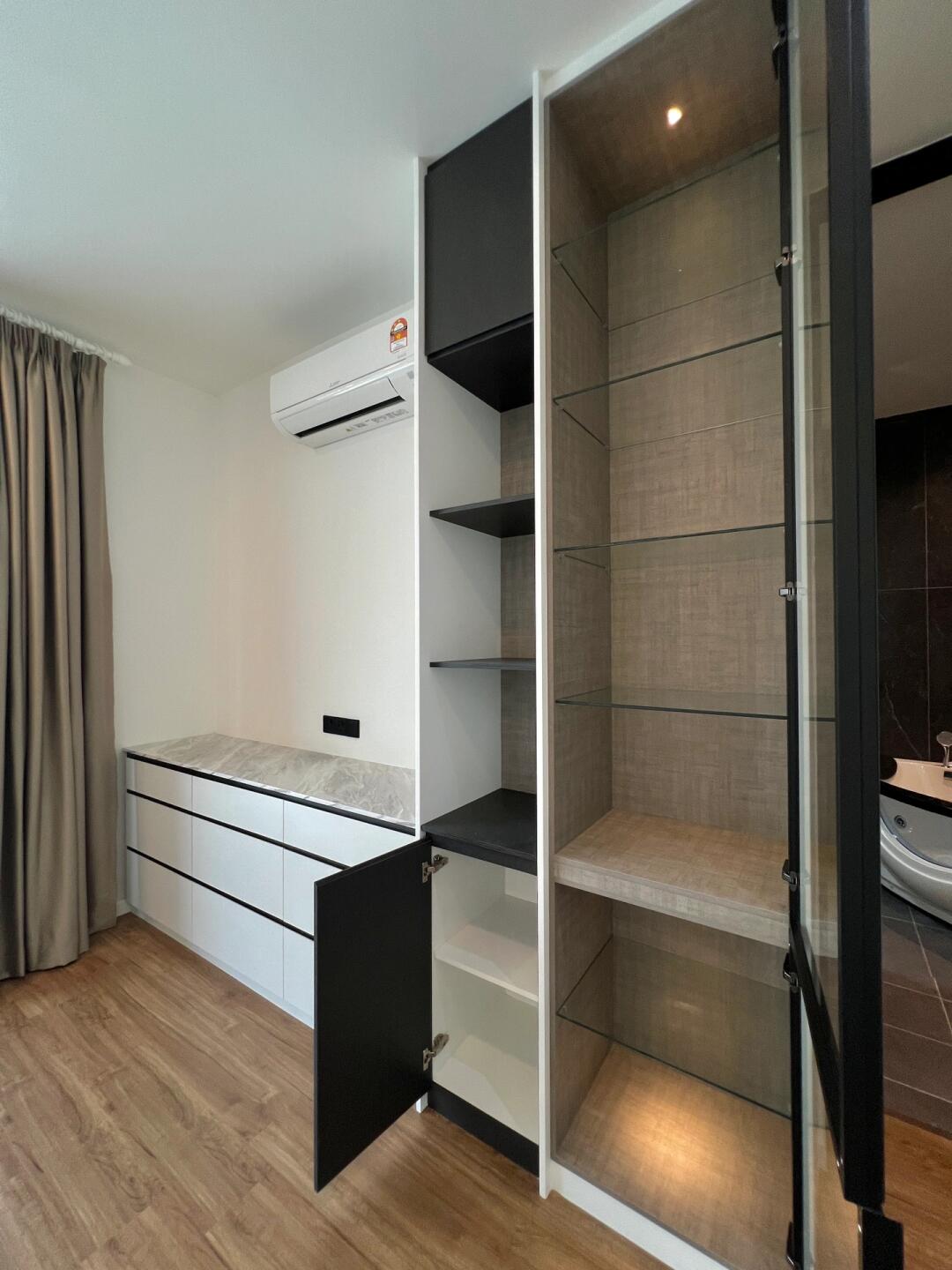 Spacious white melamine wardrobe with shelves and hanging storage for modern homes.