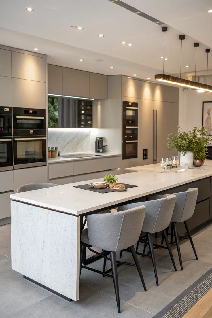 Minimalist grey kitchen with matte finish cabinets and integrated appliances, a trending option among contemporary kitchen design ideas.