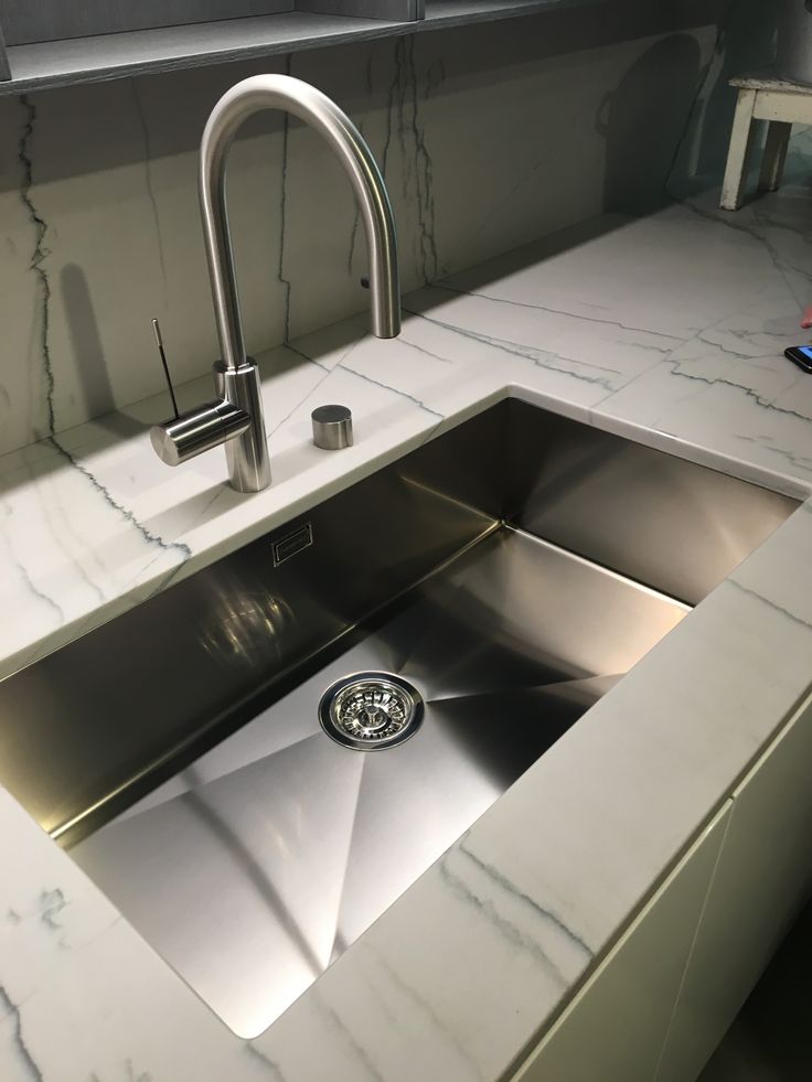 Large sintered-stone porcelain slab cabinet countertops in a matte marble look.