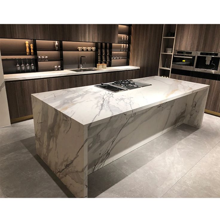 Large sintered-stone porcelain slab countertops in a matte marble look.
