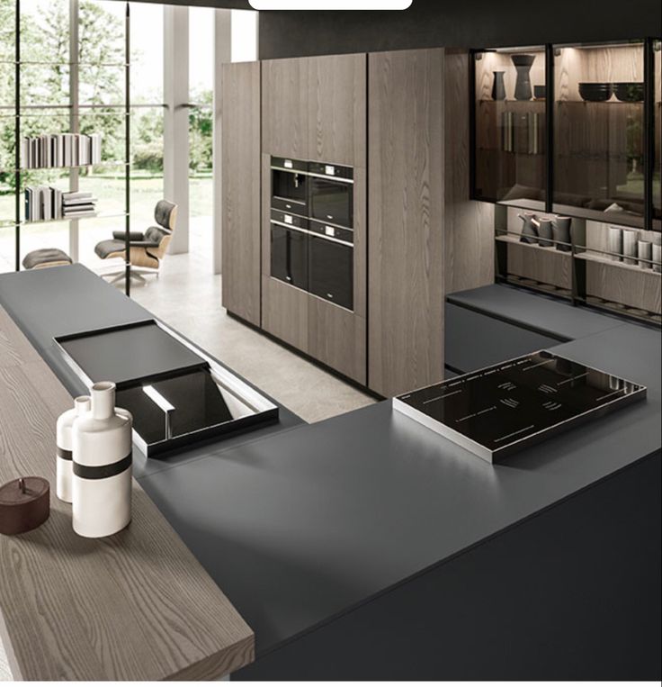 AIS Cabinet Matte black porcelain countertop on a modern kitchen island.