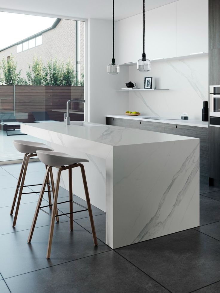 AIS Cabinet Quartz stone kitchen benchtop with light grey finish in a modern apartment kitchen.
