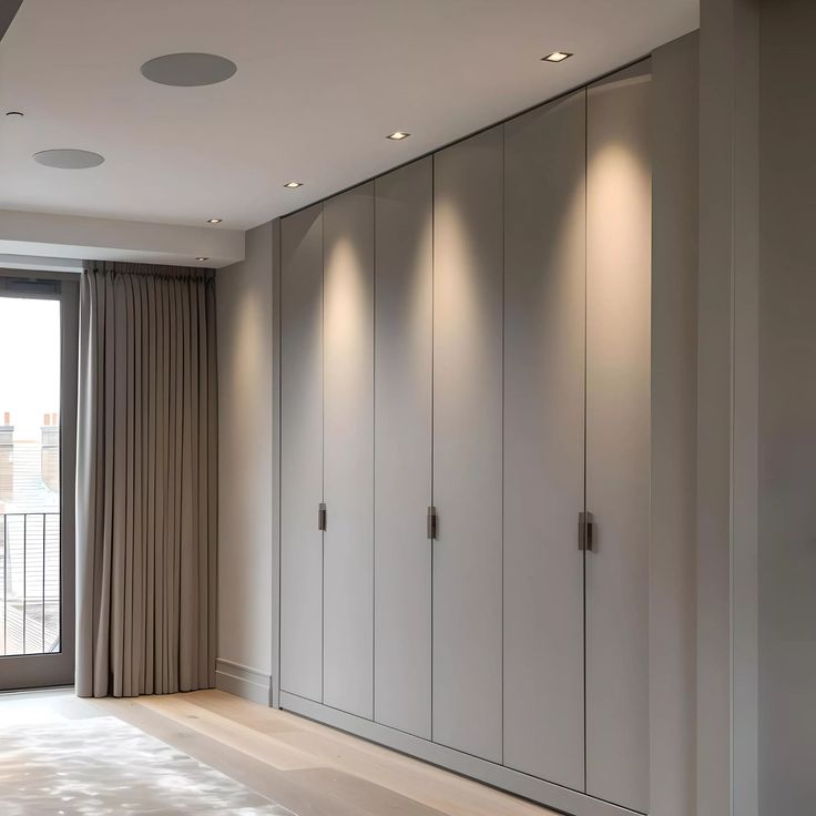 AIS Cabinet Floor-to-ceiling modern wardrobe design with clean vertical panels.